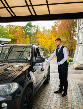 parking-valet-taking-care-customer-vehicle_23-2149946663